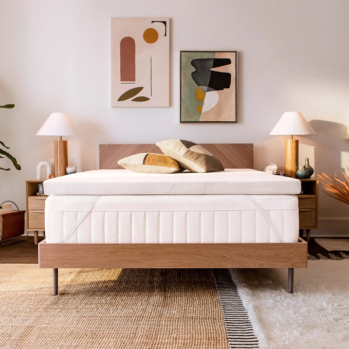 TEMPUR-Adapt mattress topper on a bed in a styled bedroom